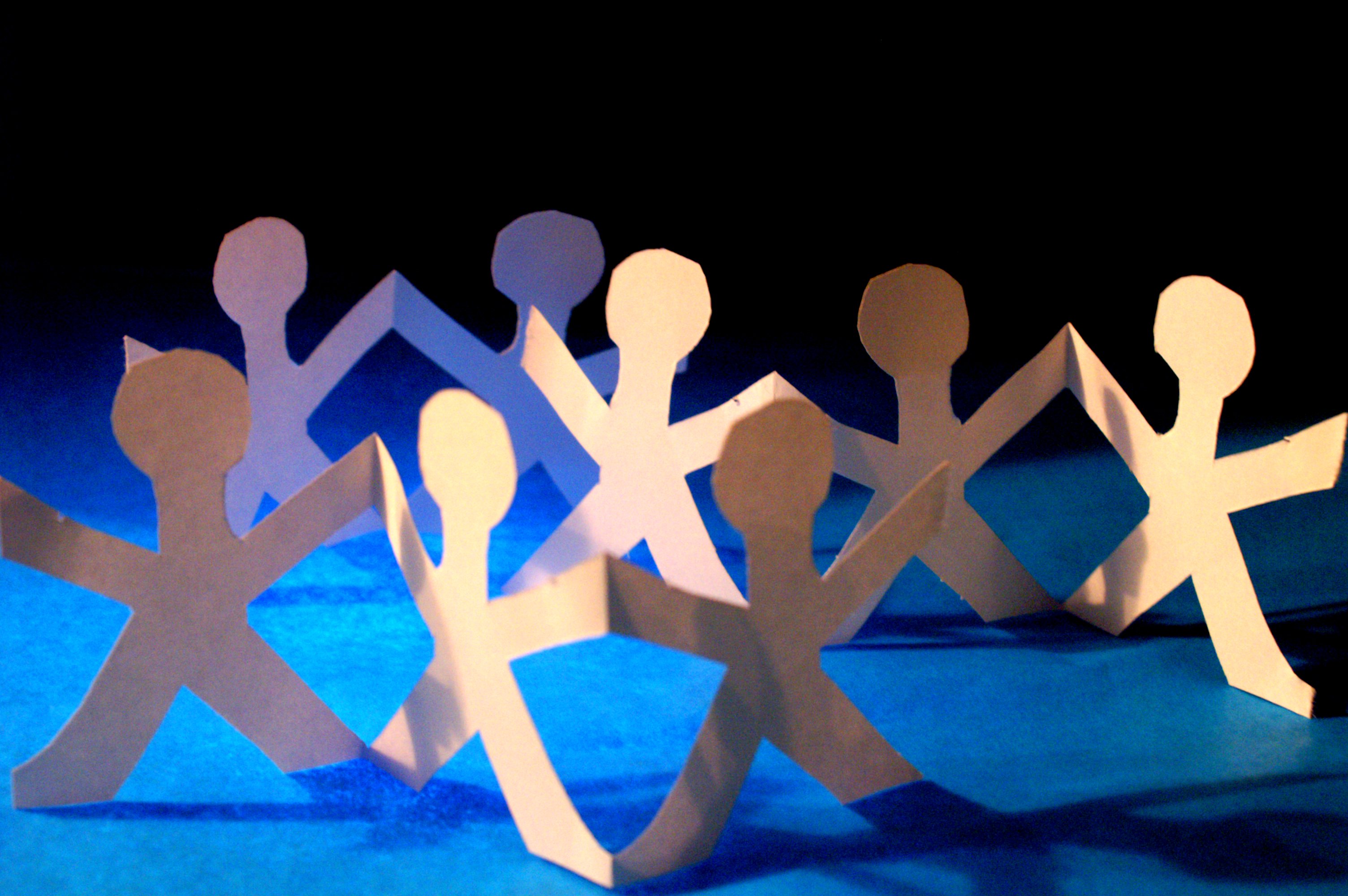 Paper cut-outs of people in a circle