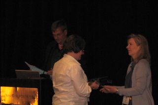 WebPAâ€™s Nicola Wilkinson receives the award from IMSâ€™ Lisa Mattson